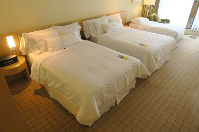 a couple of beds in a hotel room