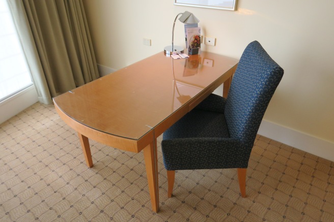 a table and chair in a room