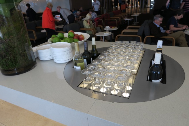 a table with wine glasses and bottles