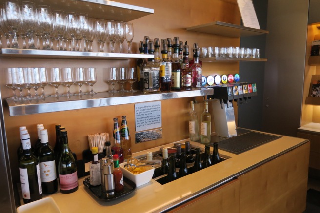 a bar with bottles and glasses