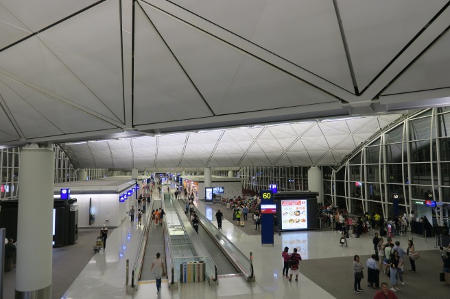 people in an airport with people walking around