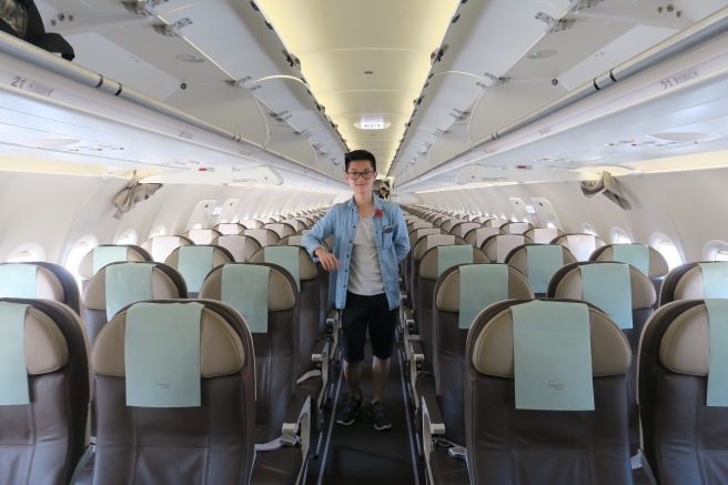 a man standing in an airplane