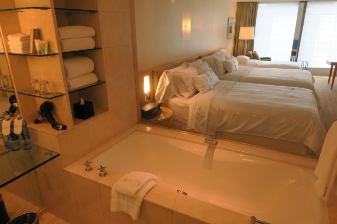 a hotel room with two beds