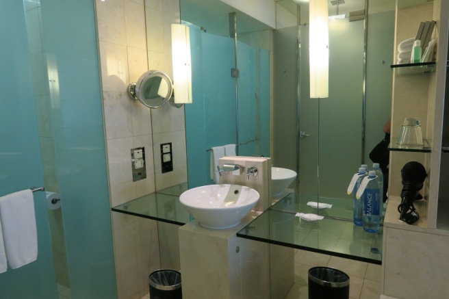 a bathroom with a glass countertop