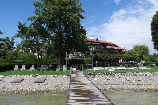 a wooden dock leading to a body of water