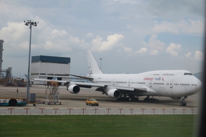 a large white airplane on a runway