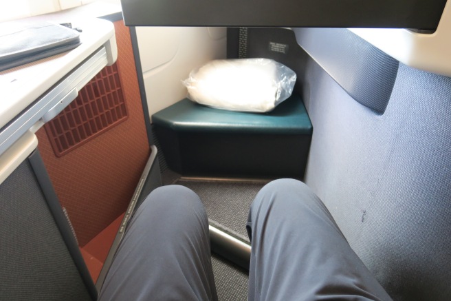 a person's legs in a seat