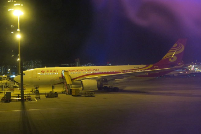 an airplane on the tarmac at night