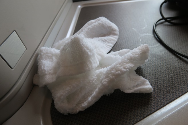 a white towel on a black surface