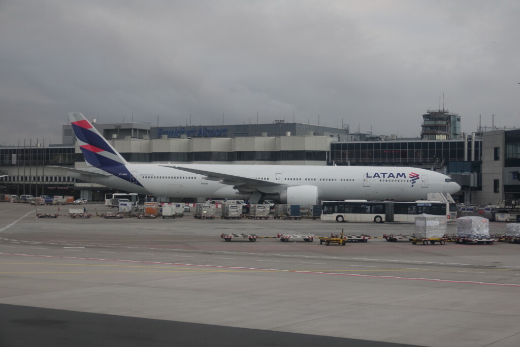 a large white airplane parked at an airport