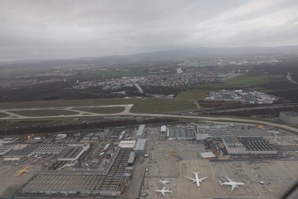 an aerial view of an airport with planes on the ground