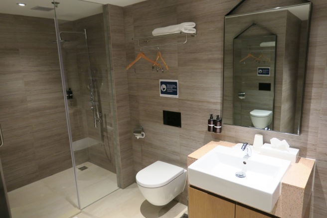 a bathroom with a shower and toilet