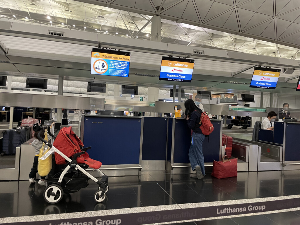 a woman standing at a counter in an airport