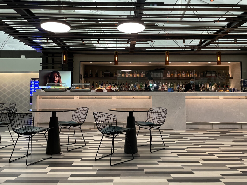 a bar with a counter and chairs