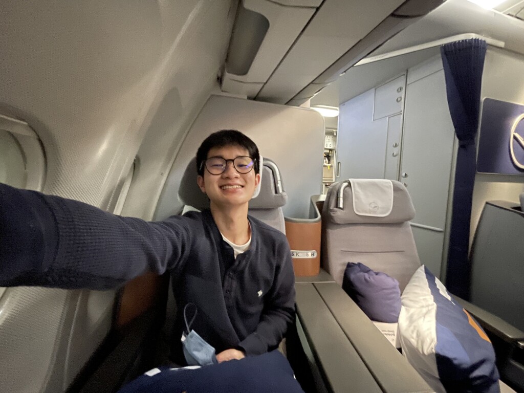 a man taking a selfie in an airplane