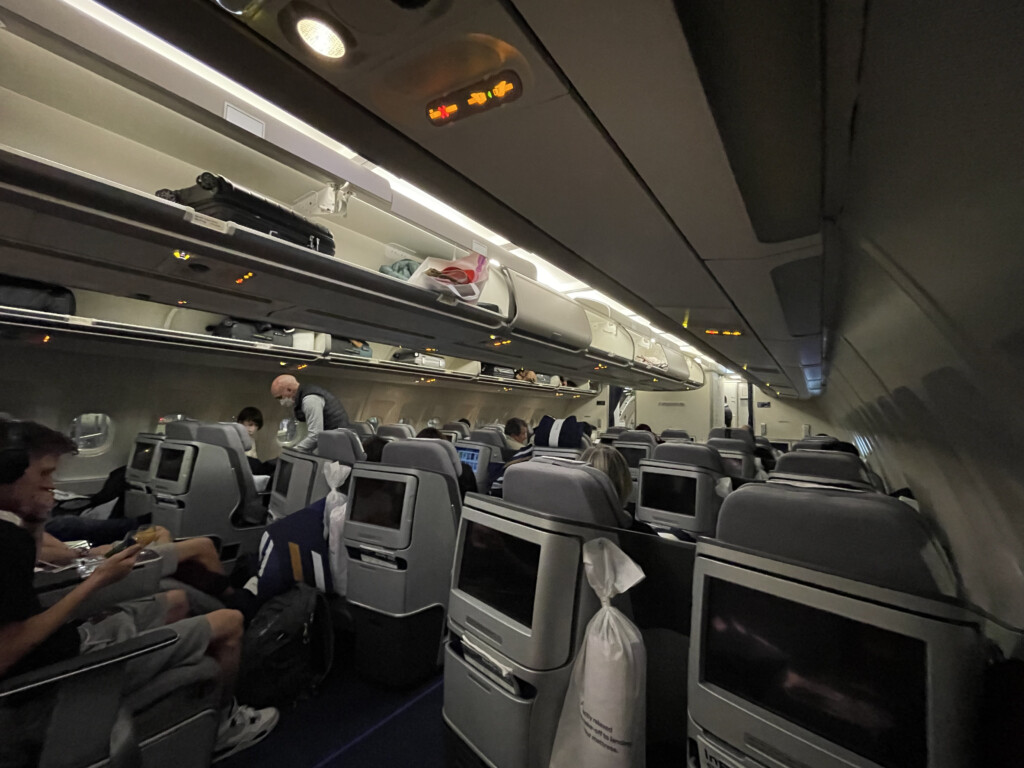 a group of people sitting on a plane