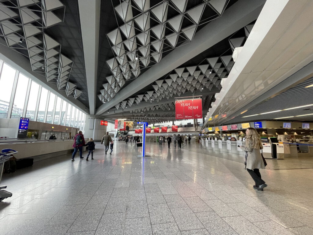 people walking in a large airport