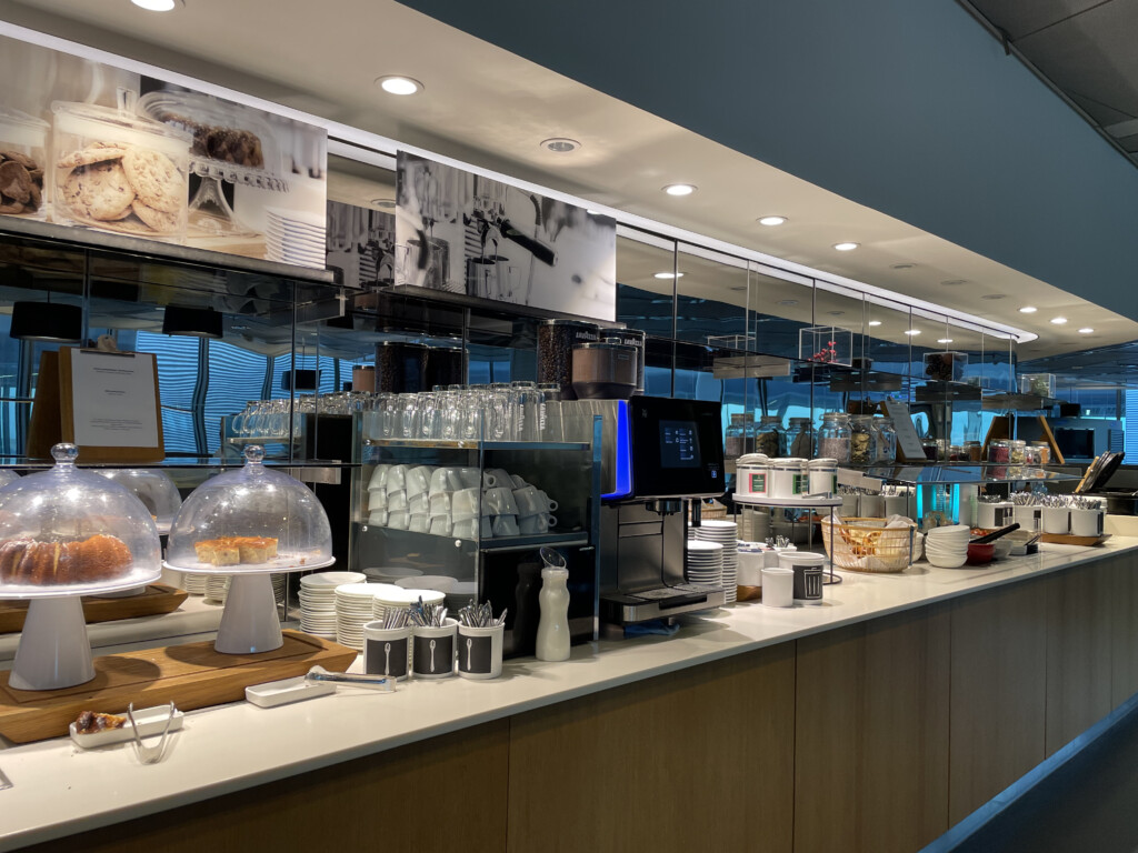 a counter with a variety of dishes and cups