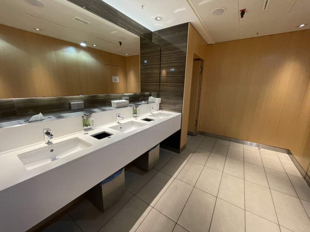 a bathroom with sinks and mirrors