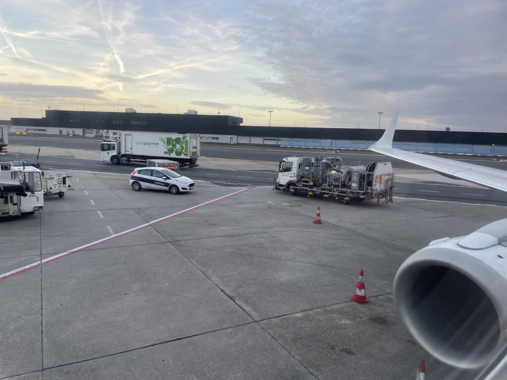 a plane and vehicles on a runway