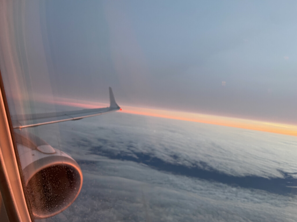 an airplane wing and the sky