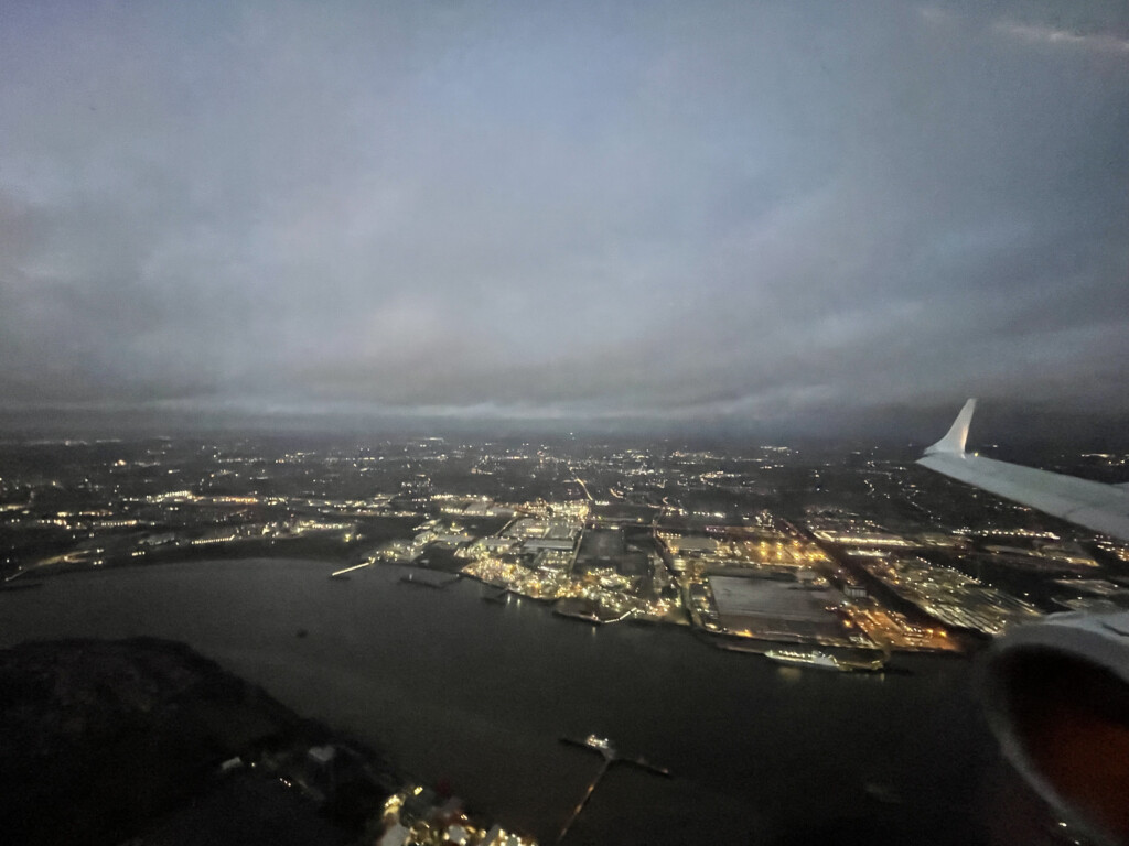 an airplane wing over a city