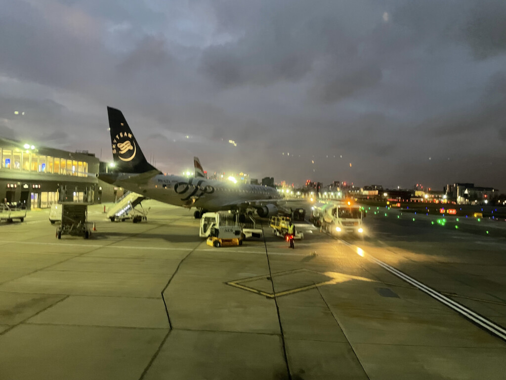 an airplane on the tarmac at night