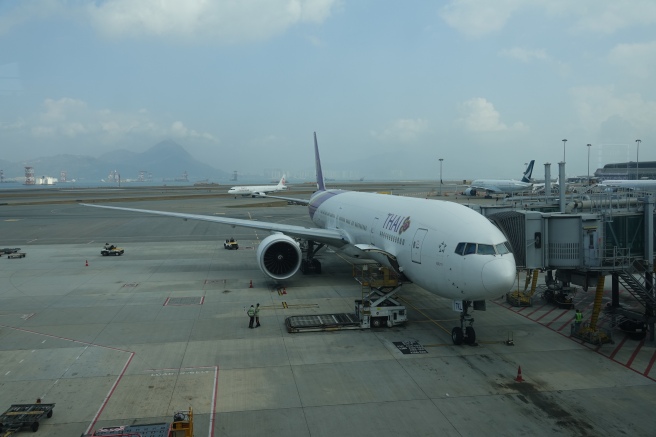 a white airplane at an airport