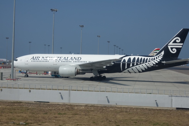 a large white airplane on a runway