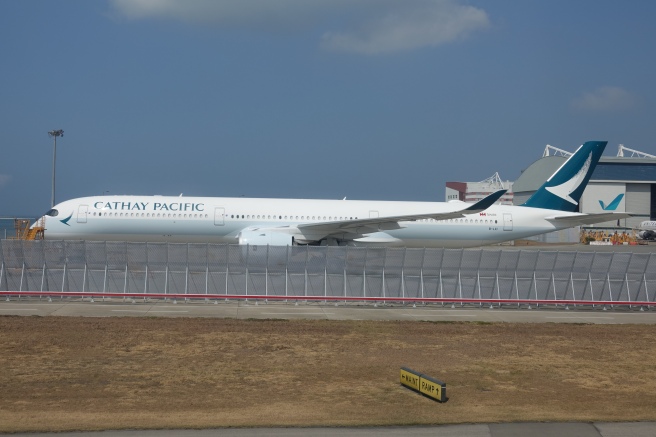 a large white airplane on a runway