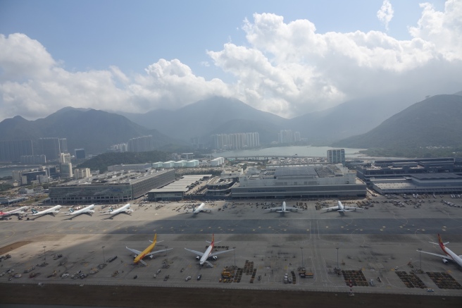 a group of airplanes at an airport