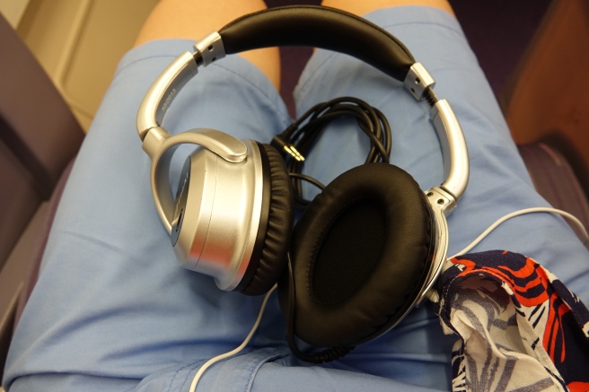 a pair of headphones on a person's lap