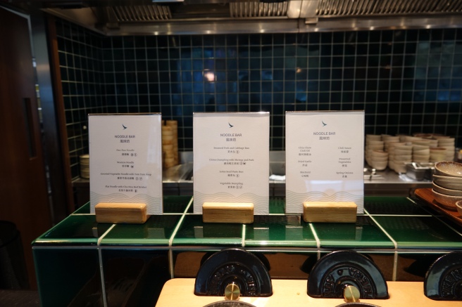 a row of white paper on green counter
