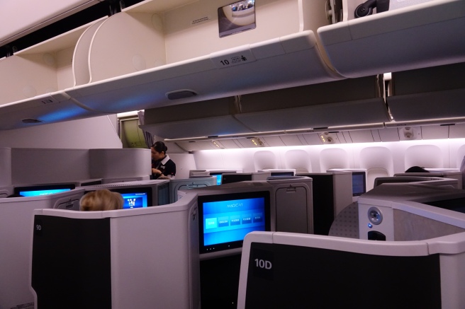 a group of people sitting in an airplane