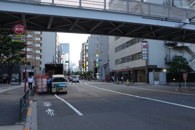 a street with cars and people on it