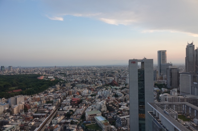 a city with tall buildings and trees