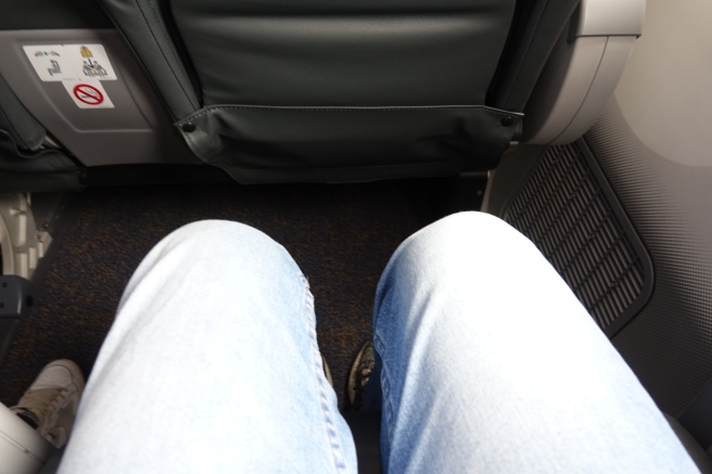 a person's legs in a seat