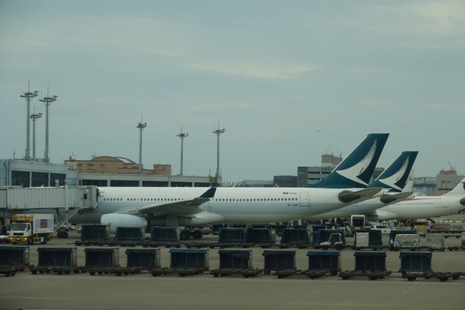 a large white airplane parked at an airport