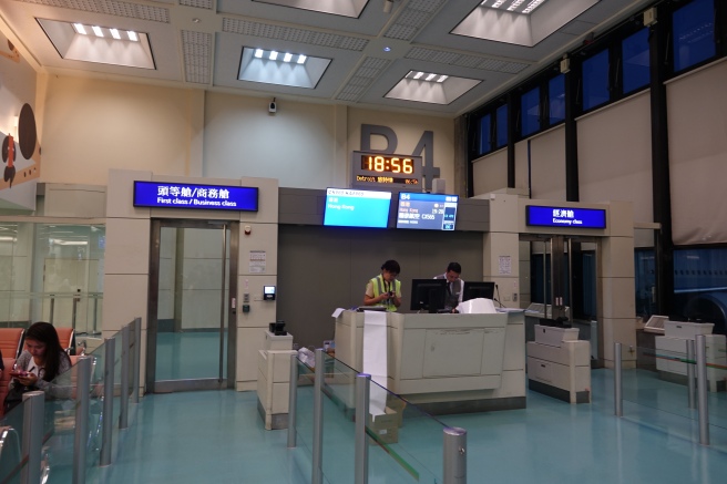 people at a desk in a airport