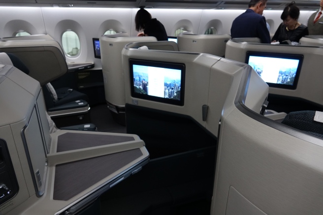 a group of people sitting in an airplane