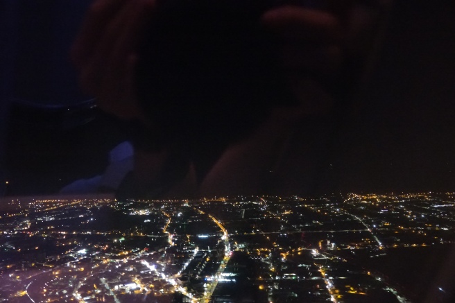 a city at night seen from a window