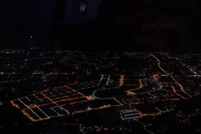 an aerial view of a city at night