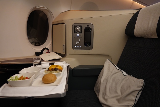 a tray of food on a tray in a plane