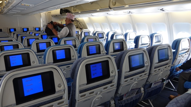 a man sitting in an airplane