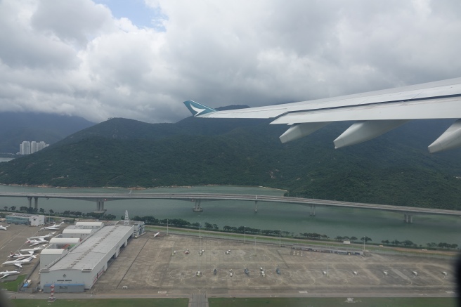 an airplane wing over a body of water