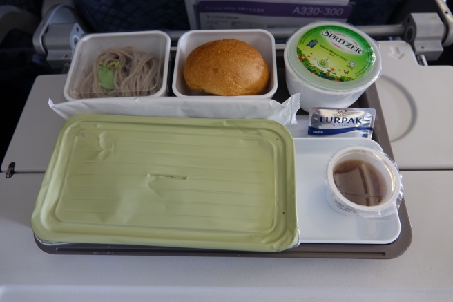 a tray of food on a plane