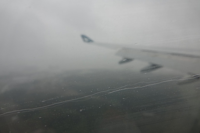 a plane wing in the rain