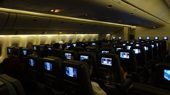 a group of people sitting in an airplane