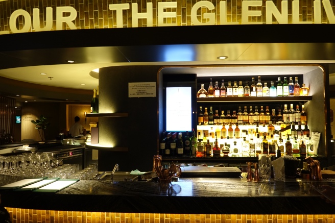 a bar with bottles of alcohol