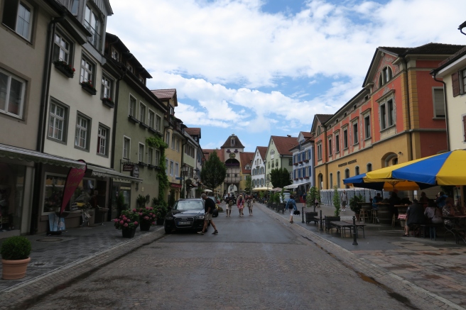 a street with buildings and people